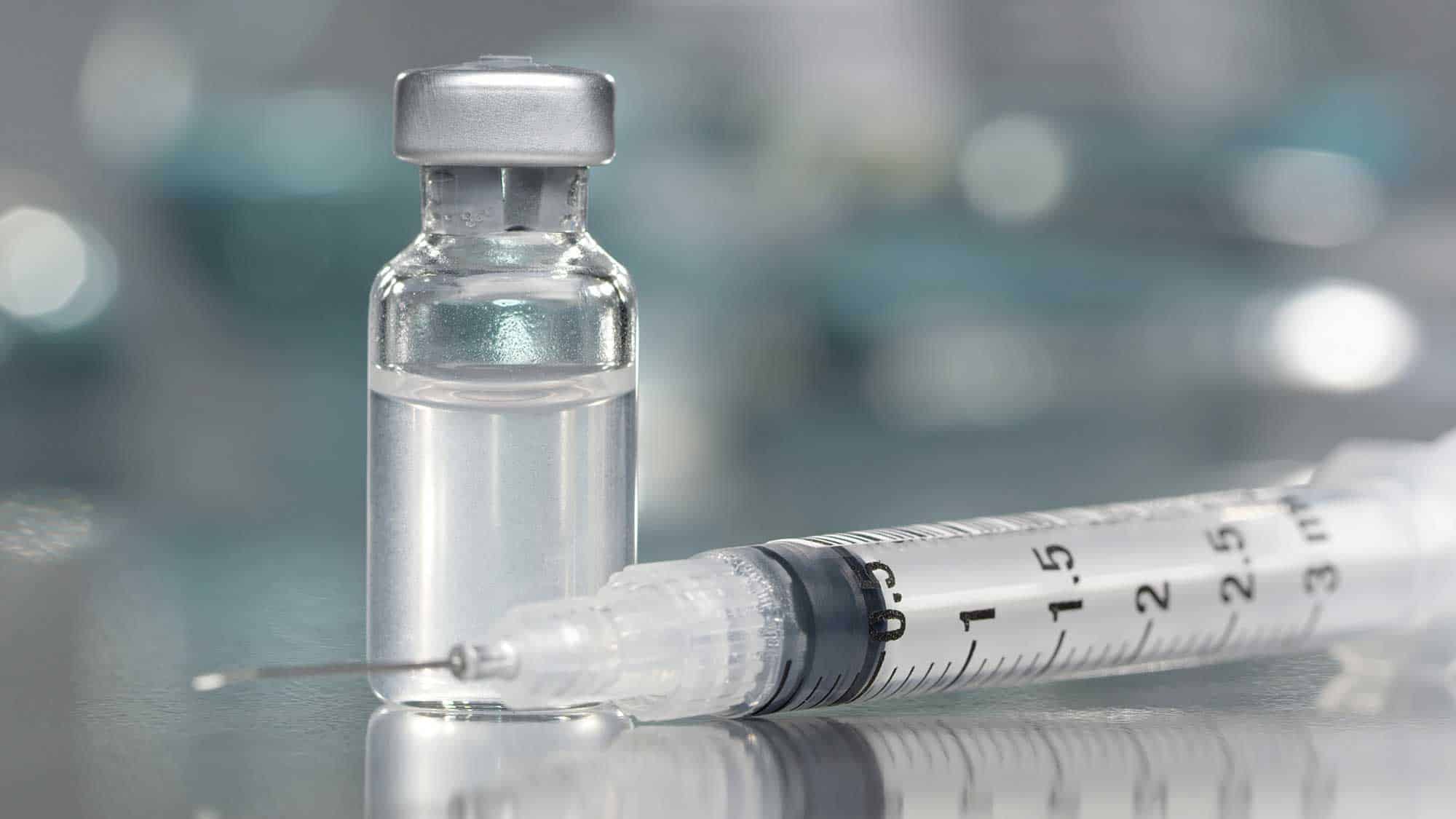 Syringe and bottle of medical liquid