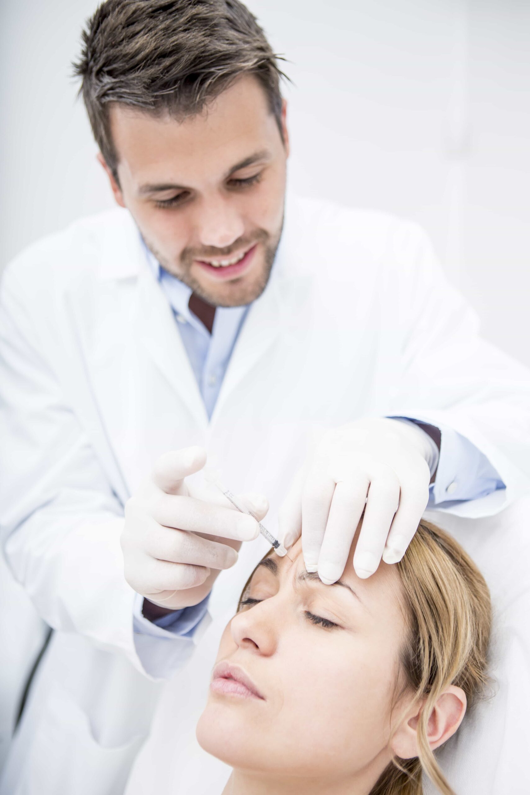 aesthetic surgery woman receiving injection into