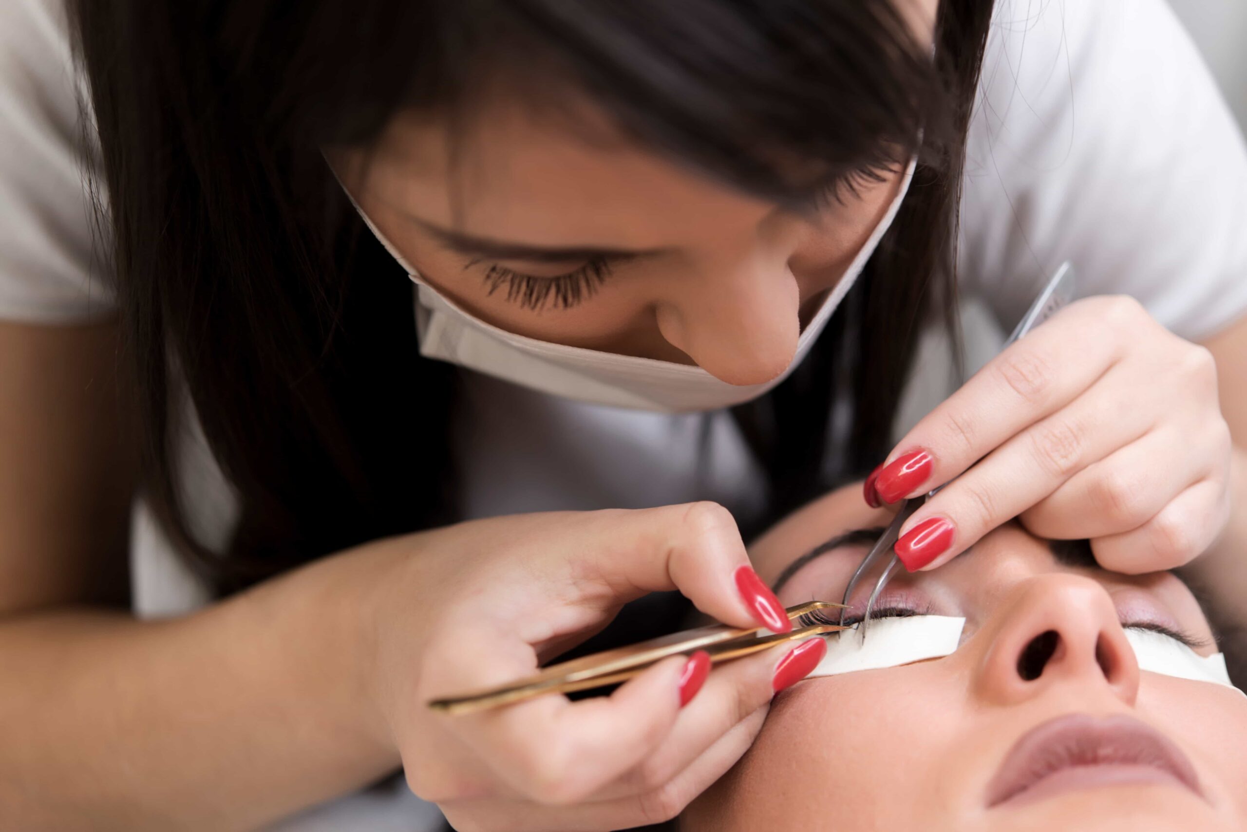 eyelash extension procedure woman eye with long