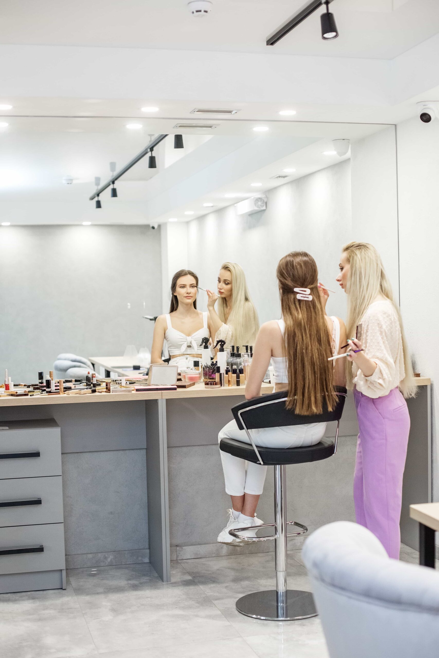 makeup artist makes makeup to a girl